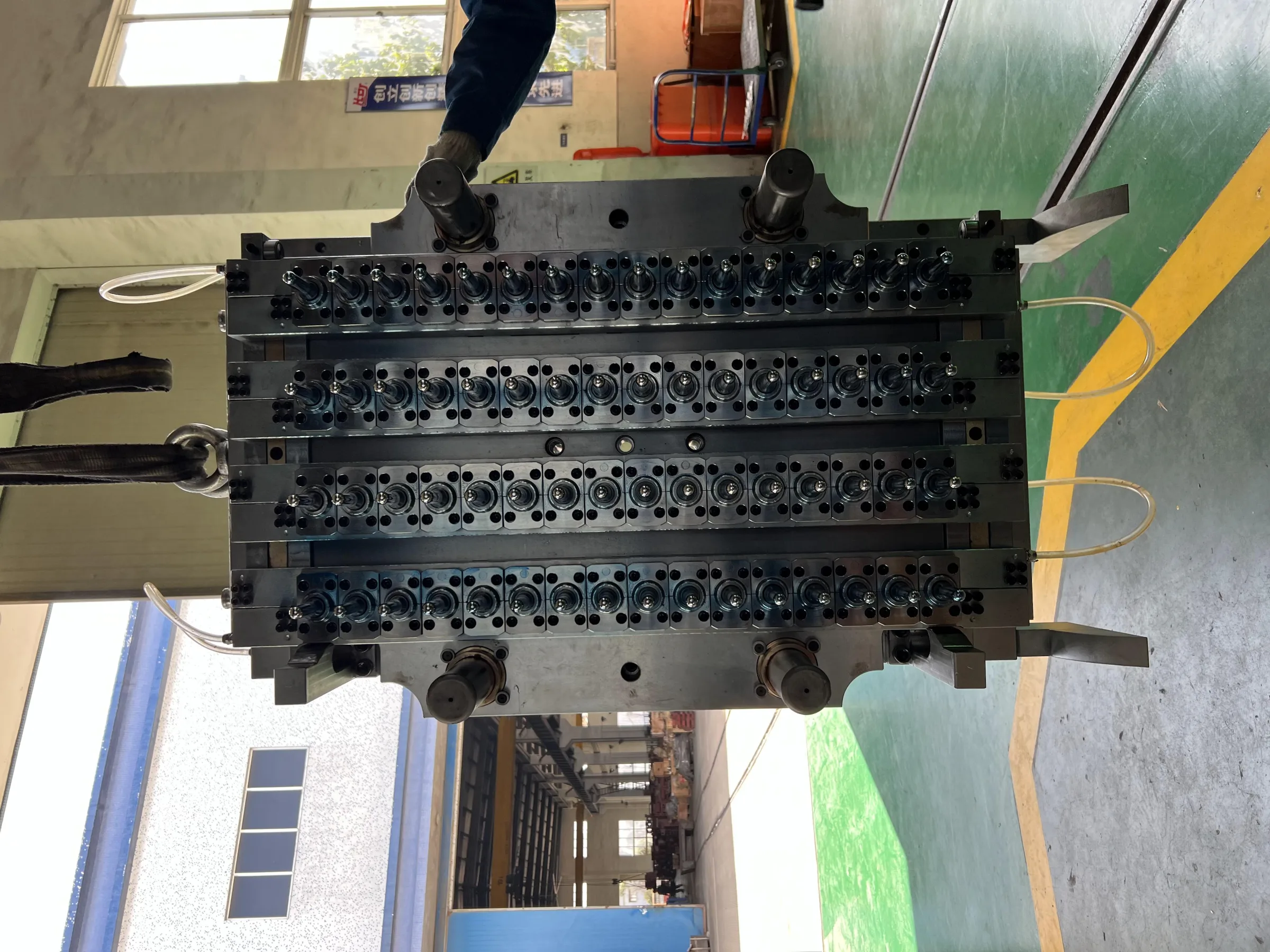 Open 64-cavity PET preform mold full view